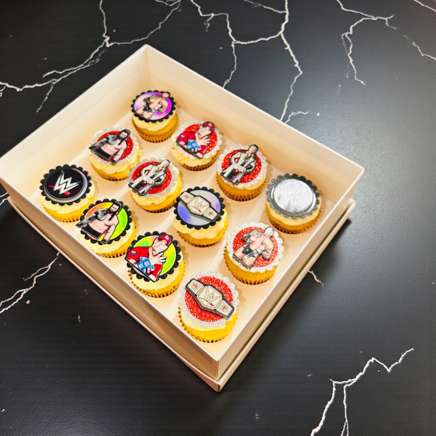12x Bespoke WWE themed cupcakes