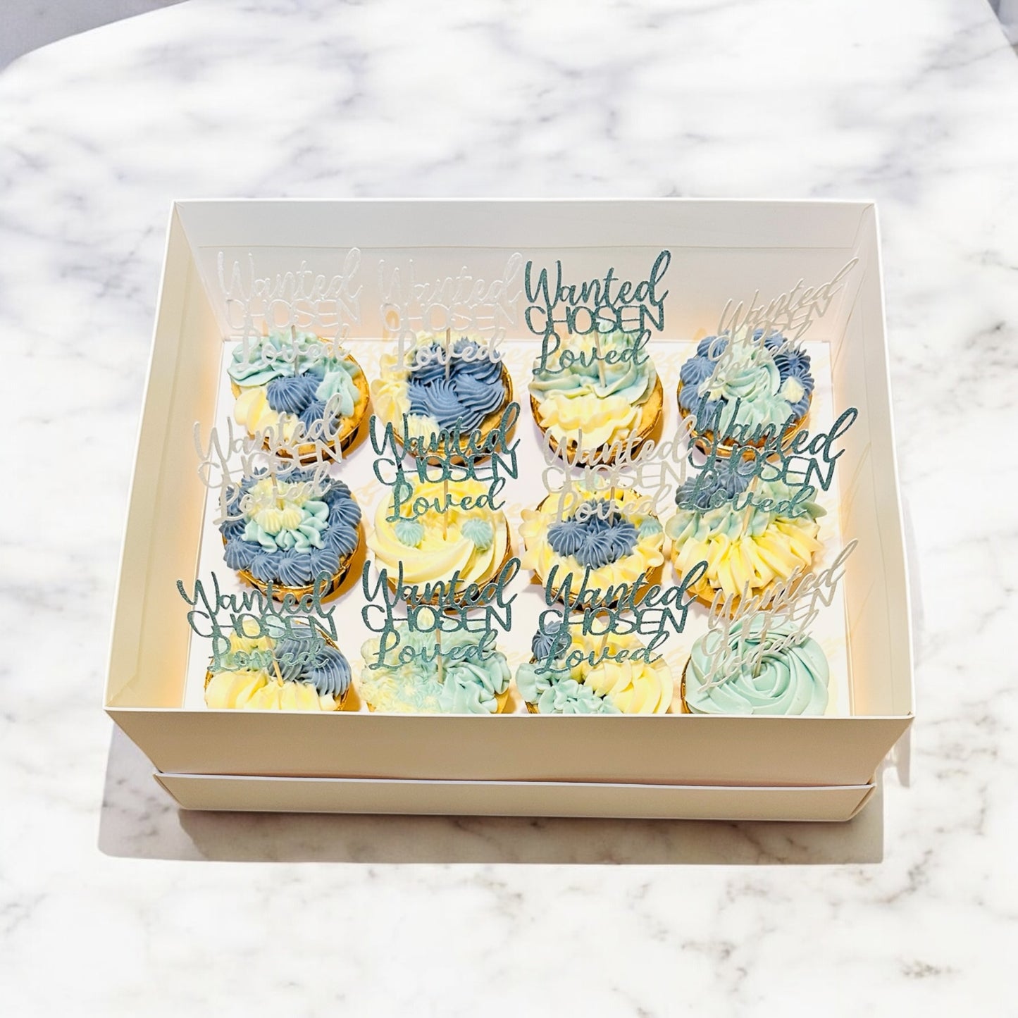 Bespoke 12 blue/white cupcakes