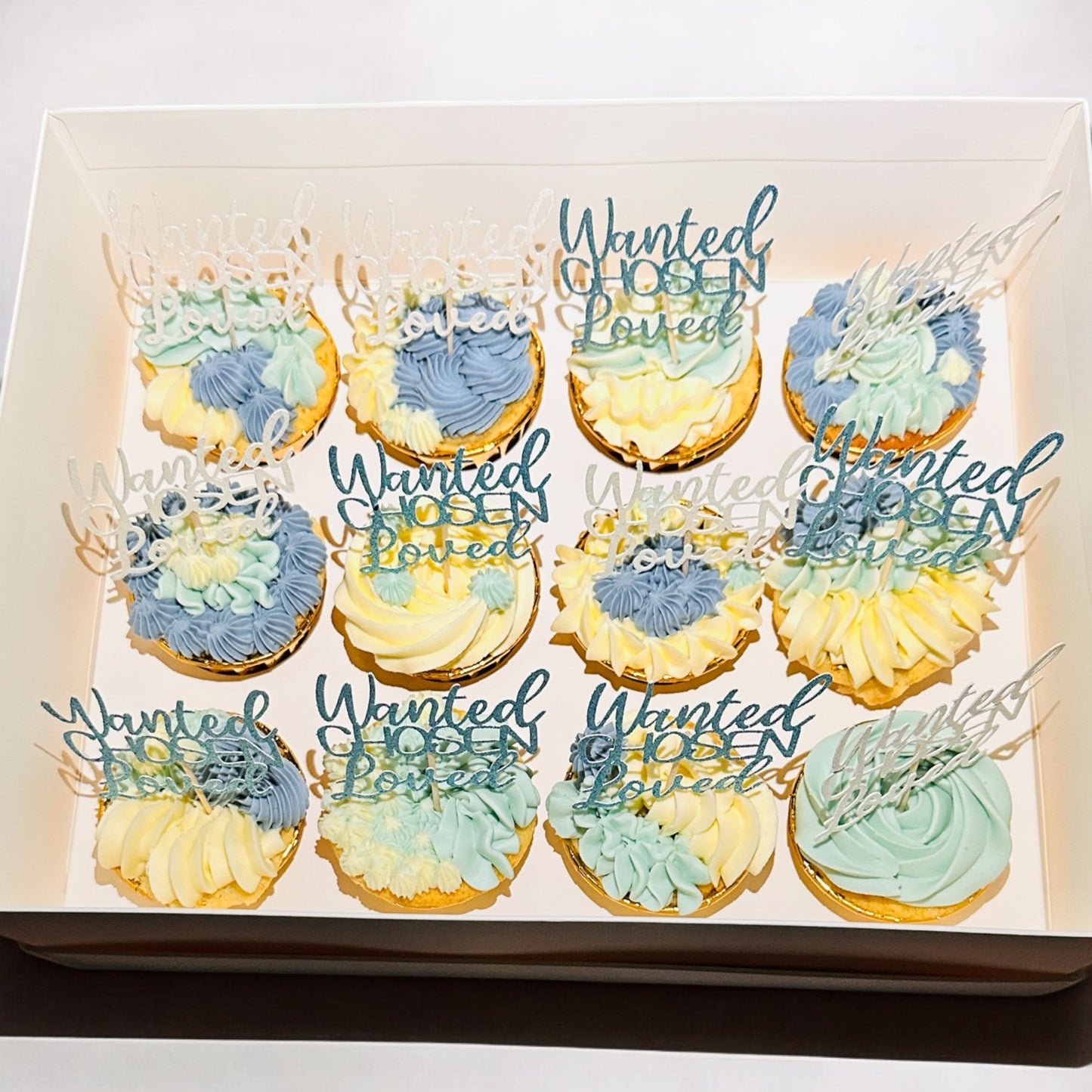 Bespoke 12 blue/white cupcakes